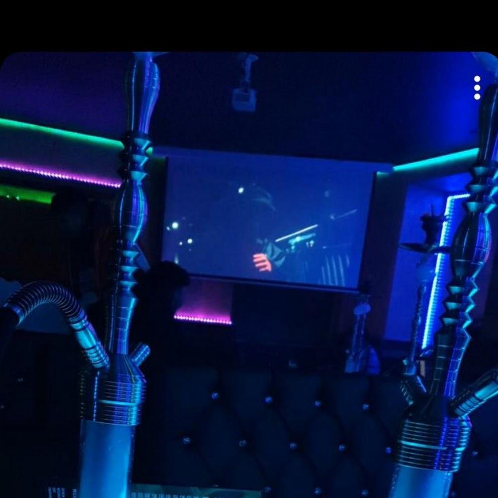 Two hookahs in a dark room with blue lights.